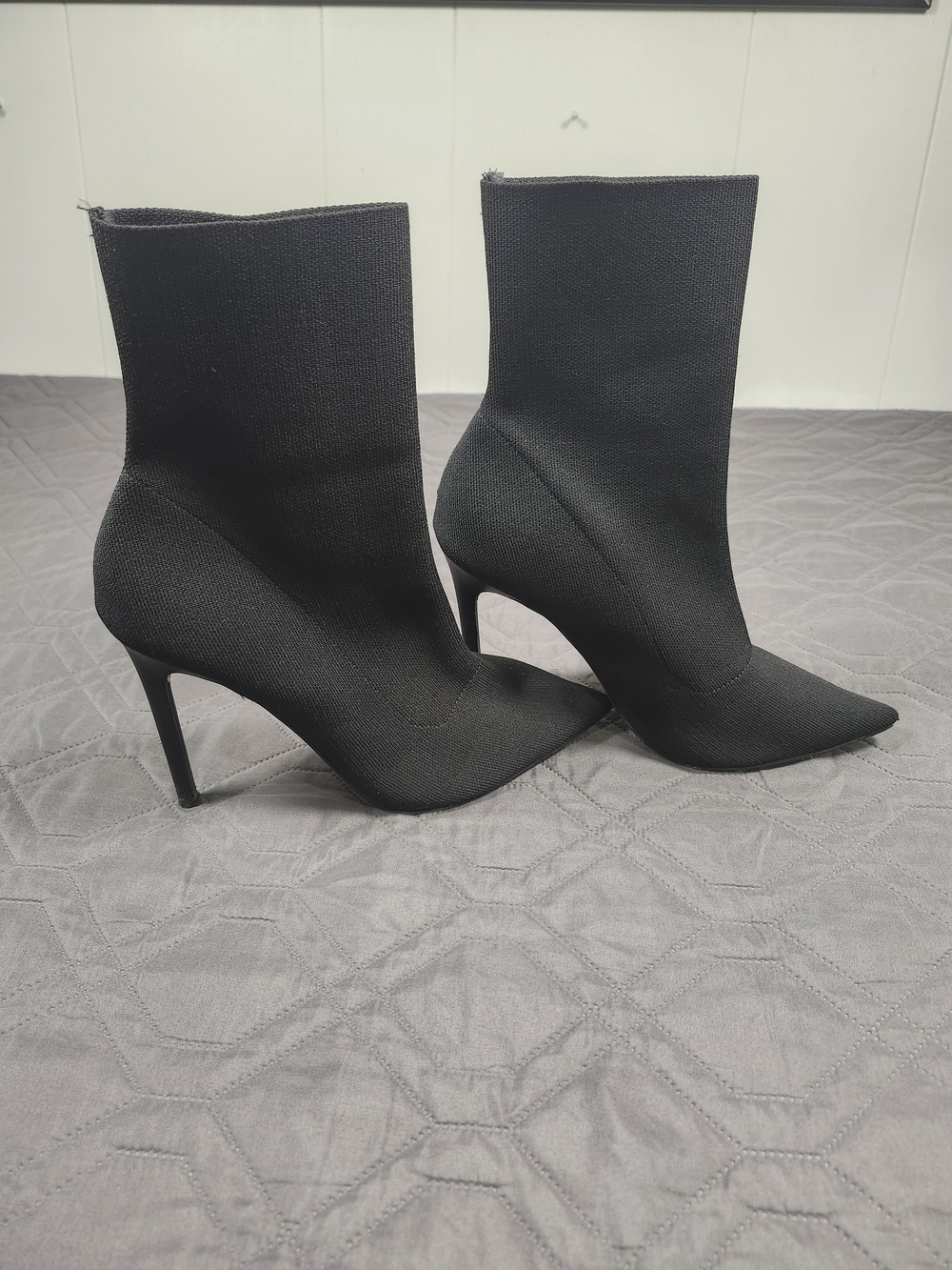 Express black pointed-toe sock booties stiletto heel size 9 has wear